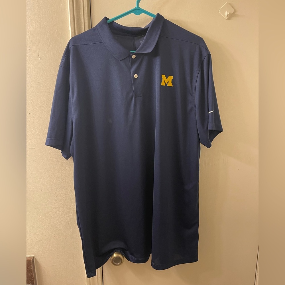 Men’s Nike University of Michigan Navy Polo Shirt with yellow accent